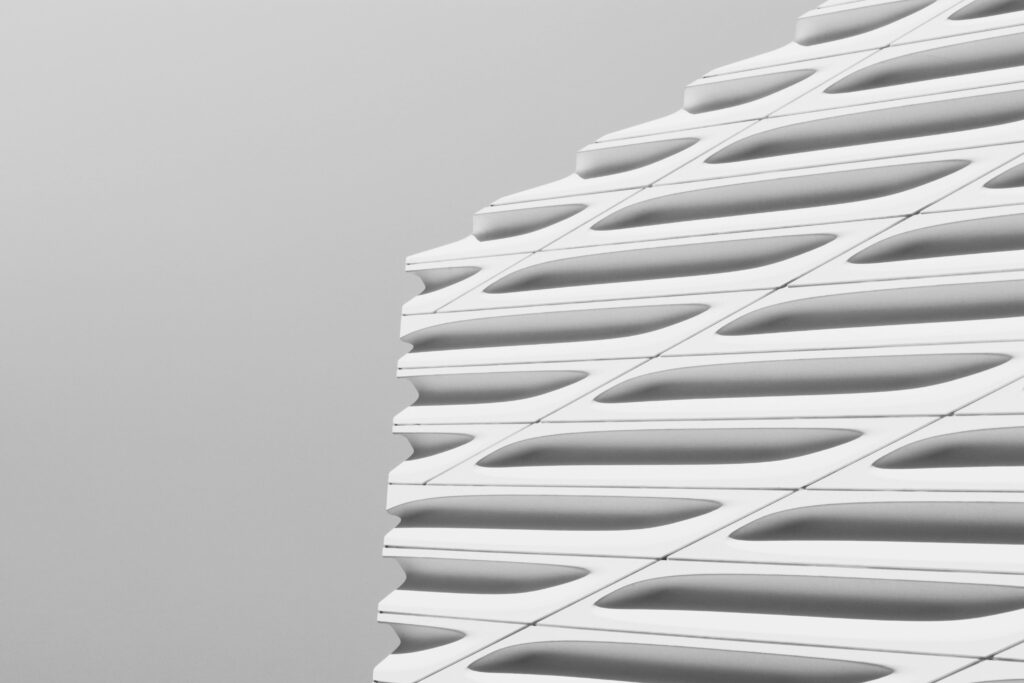 Close-up of a modern building's facade showcasing sleek, geometric architectural design.