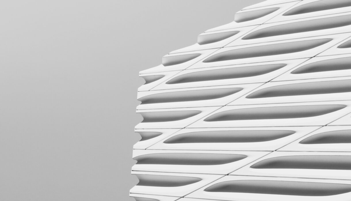 Close-up of a modern building's facade showcasing sleek, geometric architectural design.