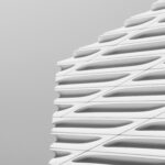 Close-up of a modern building's facade showcasing sleek, geometric architectural design.